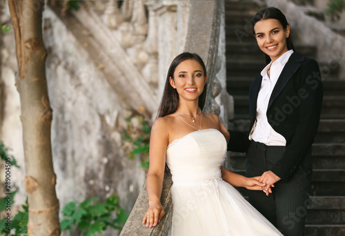 Beautiful Lesbian Couple On Their Wedding Day Outdoors Buy This