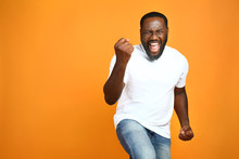 Happy African-American Man On Color Background