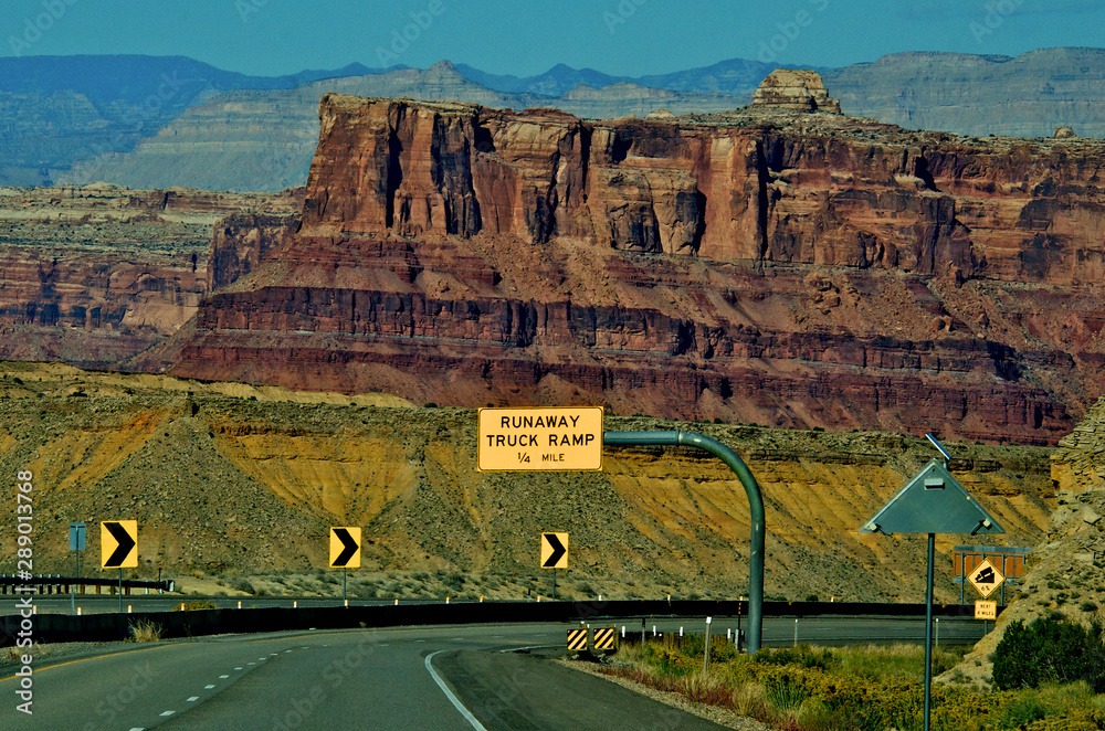 Trucker “Runaway Ramp” and warning of steep grade with curve warning ...