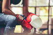 Muay Thai woman and Healthy concept.Boxing Women prepare to trianing session and kickboxing,workout at thai boxing gym.Fit Female exercise hard to strengther muscle.