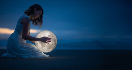 Wall Mural - tender image of a girl. female magic. beautiful attractive girl on a night beach with sand and stars