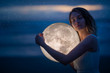 © Anton - delicate image of an angel, a girl with the moon in her hands on the night beach. artistic photography. Fairy tale and riddle. Astrology and zodiac signs.
