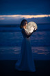 © Anton - delicate image of an angel, a girl with the moon in her hands on the night beach. artistic photography. Fairy tale and riddle. Astrology and zodiac signs.