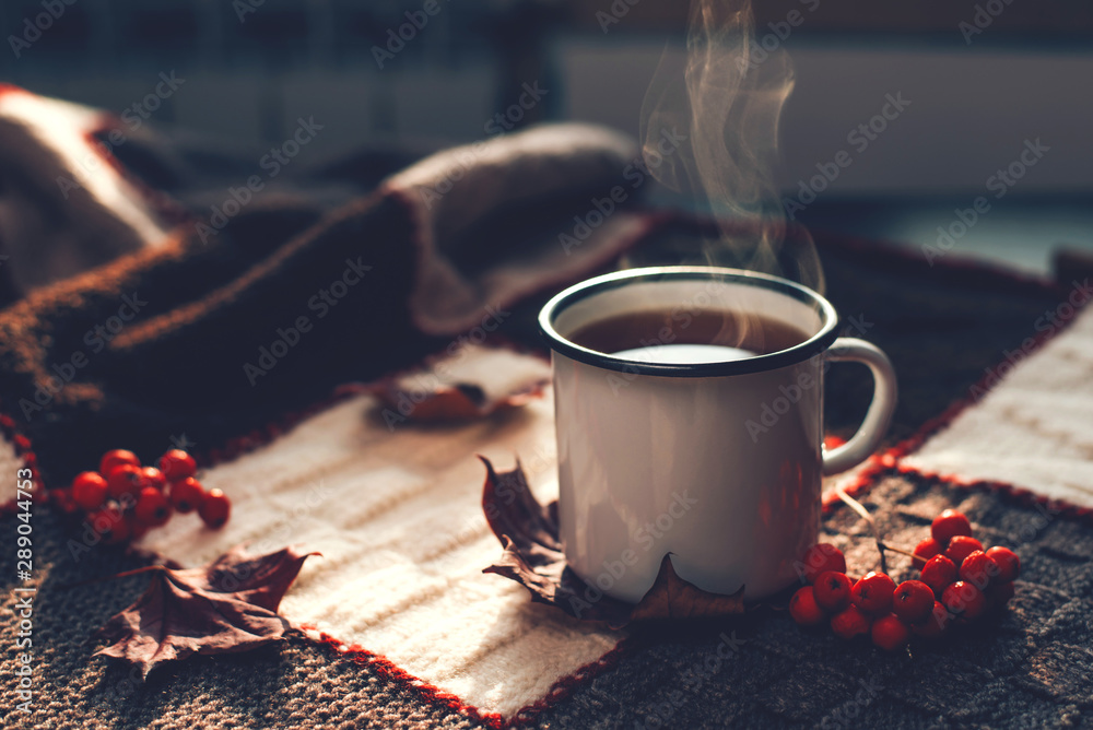 Autumn hot steaming cup of coffee or tea. - obrazy, fototapety, plakaty 