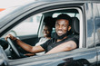 © F8  \ Suport Ukraine - Young african couple drive car in road trip