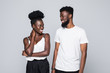 © F8  \ Suport Ukraine - Casual african couple smiling at each other on white background