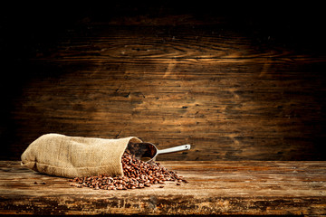 Wall Mural - Fresh coffee grains in brown sack and free space for your decoration. 