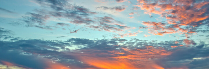 Wall Mural - blue and orange sky with clouds, panoramic background