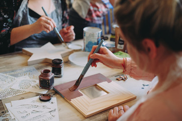 master class on creativity. girl makes a frame