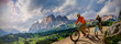 canvas print picture - Couple cycling on electric bike, rides mountain trail. Woman and Man riding on bikes in Dolomites mountains landscape. Cycling e-mtb enduro trail track. Outdoor sport activity.