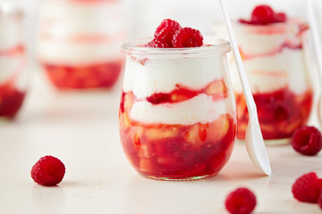 Peach and raspberry dessert with yogurt cream