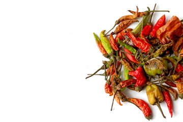 Mixed dried red and green chilies isolated on white background 