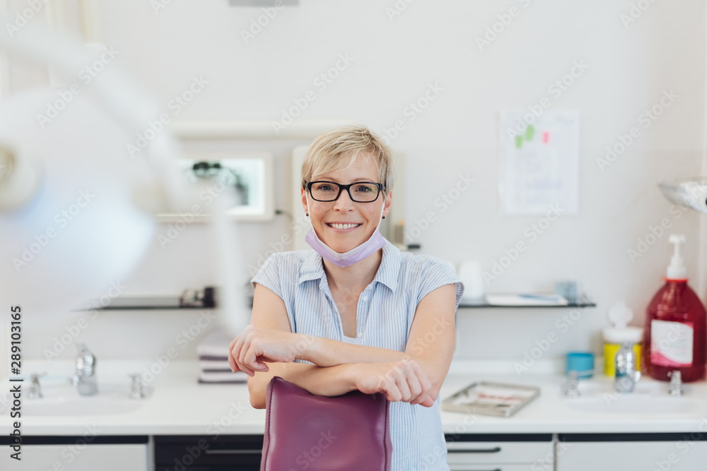 Smiling friendly dentist or dental nurse
