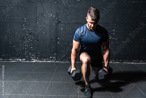Cuadros en Lienzo Young strong fit muscular sweaty man with big muscles strength cross workout tra