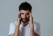 © SB Arts Media - Portrait of sad man in pain having headache and migraines