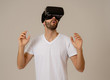 © SB Arts Media - Portrait of excited and amazed young man wearing Virtual Reality headset exploring 3D world