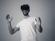 © SB Arts Media - Portrait of excited and amazed young man wearing Virtual Reality headset exploring 3D world