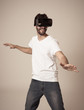 © SB Arts Media - Portrait of excited and amazed young man wearing Virtual Reality headset exploring 3D world