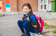 © Louis-Photo - A student school girl on the playground on the first day of class