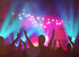 soft focus of christian people group raise hands up worship God Jesus Christ together in church revival meeting with blurred music concert light background can be used for Christian worship background
