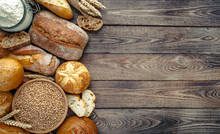 Assortment Of Baked Bread On Wooden Table Background,top View