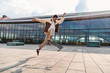 © pavelgulea - African american guy doing ollie with skateboard
