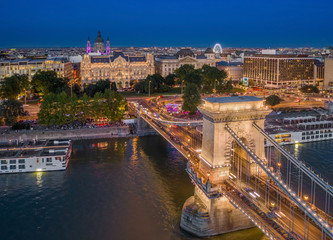 Wall Mural - Budapest, Hungary - Aerial view of Szechenyi Chain Bridge with St. Stephen's Basilica, ferris wheel and cruise ships at blue hour on a nice summer evening