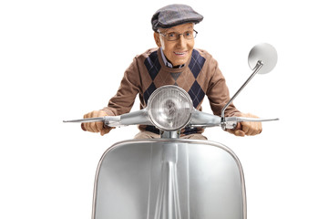 Wall Mural - Senior gentleman on a silver vintage motorbike