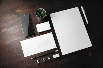 Photo of blank stationery set on wooden background. Corporate identity mockup. Responsive design template.