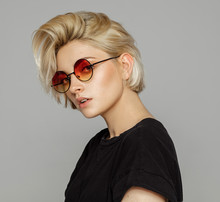 Portrait Of Blond Woman In Retro Sunglasses