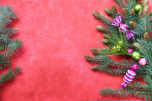 Red Christmas Background With Greenery Border And Lime Green And Pink Ornaments