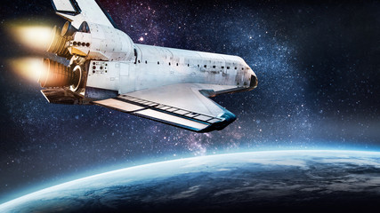 Leinwandbilder - Space shuttle rocket in outer space over Earth planet. Ocean and clouds on surface. Sci-fi wallpaper. View from ISS. Cosmos background. Elements of this image furnished by NASA