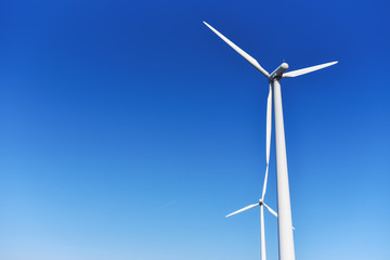 windmills on blue sky background