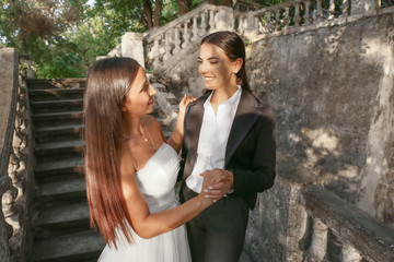 Sticker - Beautiful lesbian couple on their wedding day outdoors