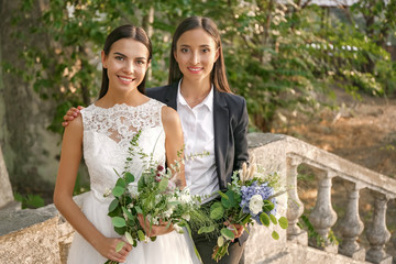 Canvas Print - Beautiful lesbian couple on their wedding day outdoors