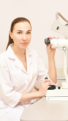 Wall Mural - Eye ophthalmologist exam. Eyesight recovery. Astigmatism check concept. Ophthalmology diagmostic device. Beauty girl portrait in clinic