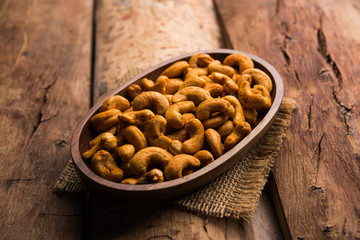 Wall Mural - Masala Kaju or spicy Cashew in a bowl. Popular festival snack from India/asia, also known as Chakna recipe