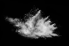 White Powder Explosion On Black Background. Colored Cloud. Colorful Dust Explode. Paint Holi.