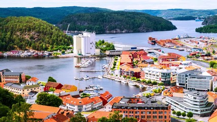 Wall Mural - Halden, Norway. Aerial view of the houses and yachts in port of Halden, Norway. Time-lapse during the cloudy day in summer