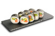 Sushi Rolls with salmon, avocado, cucumber and Cream Cheese inside wrapped in nori leaf isilated