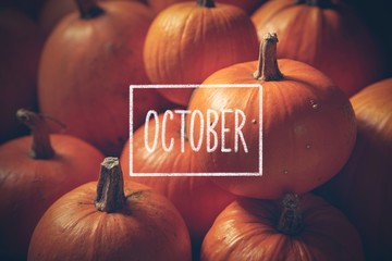 pumpkins with hand drawn chalk text october
