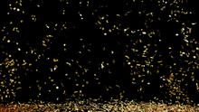 A Fountain Of Golden Confetti Falling On The Floor On An Black Background