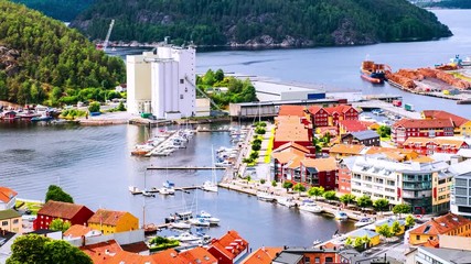 Wall Mural - Halden, Norway. Aerial view of the houses and yachts in port of Halden, Norway. Time-lapse during the cloudy day in summer, panning video