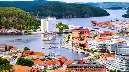 Wall Mural - Halden, Norway. Aerial view of the houses and yachts in port of Halden, Norway. Time-lapse during the cloudy day in summer, zoom in