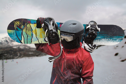 Cuadros en Lienzo Snowboarder with a board on his shoulders