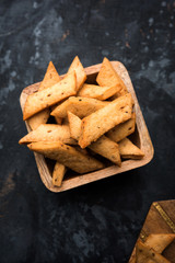 Wall Mural - Namakpare or Salty Shakarpara/shakarpare or namkeen Shankarpali, popular diwali food or tea-time snack from Gujarat, India