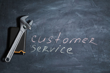 IT support, client and Customer service concept. Hard drive a wrench and the words customer Support