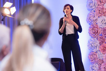 Beautiful Business Woman With Microphone In Her Hand Speaking At The  Conference Or Seminar.