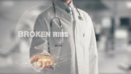 Poster - Doctor holding in hand Broken ribs