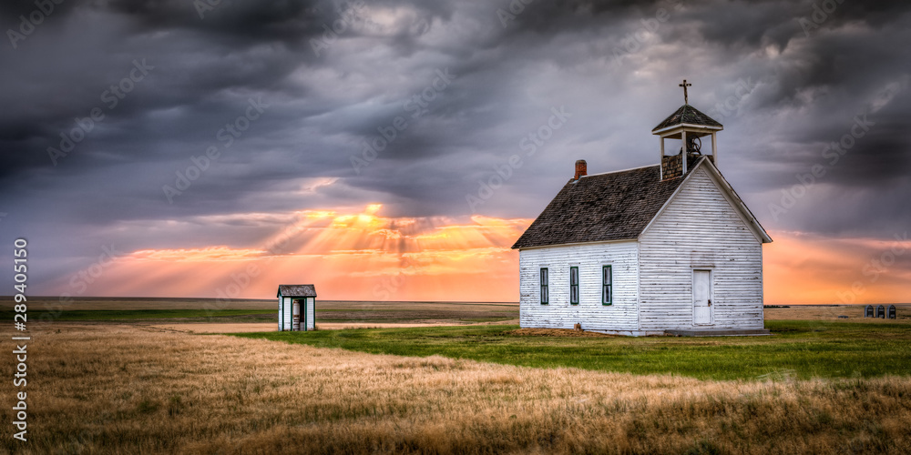 Old Rural Church at Sunset with Sunrays Beaming Down From the Sky Stock ...